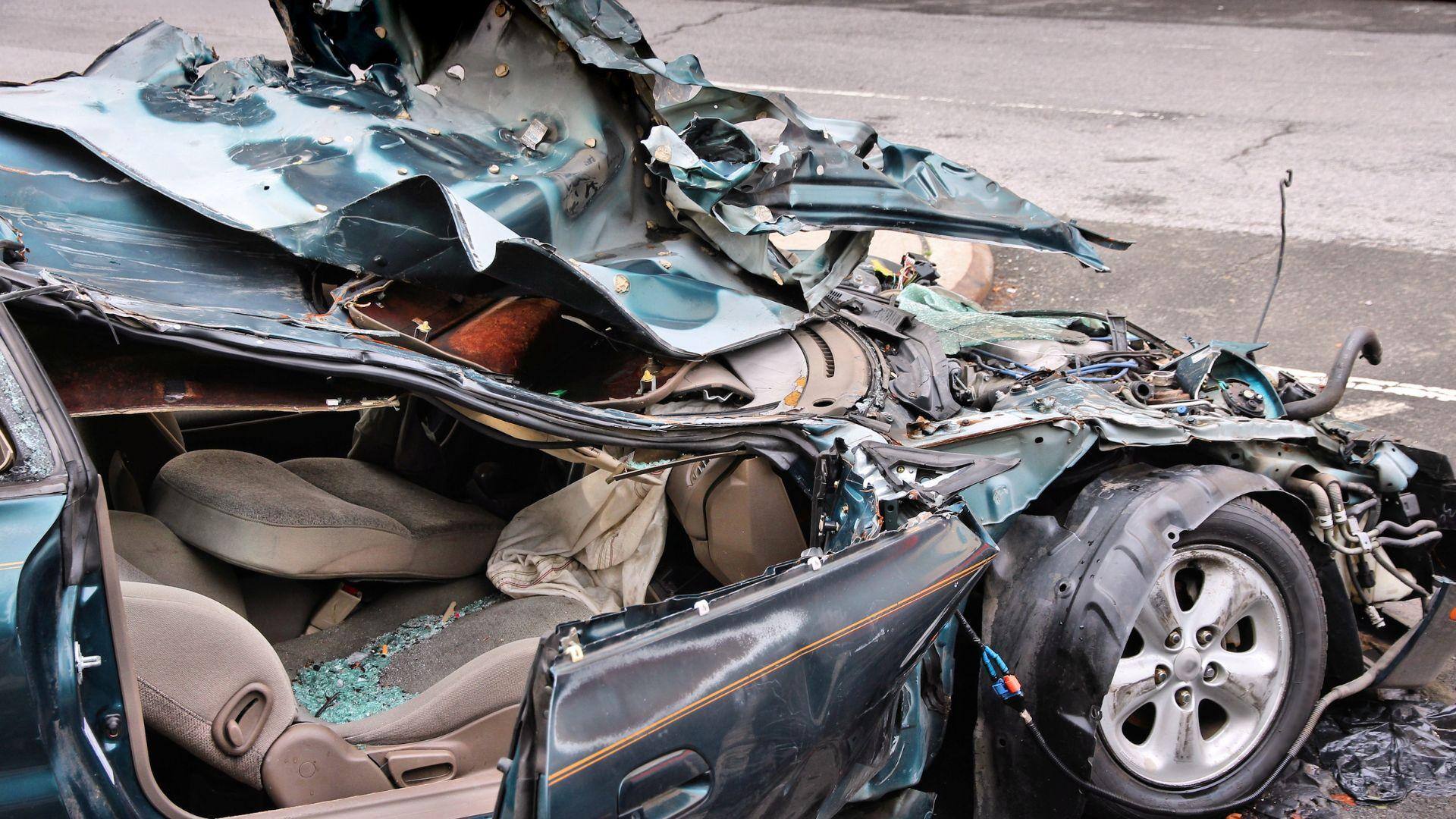 Car that has been destroyed in a collision with a semi truck in Alabaster, Alabama