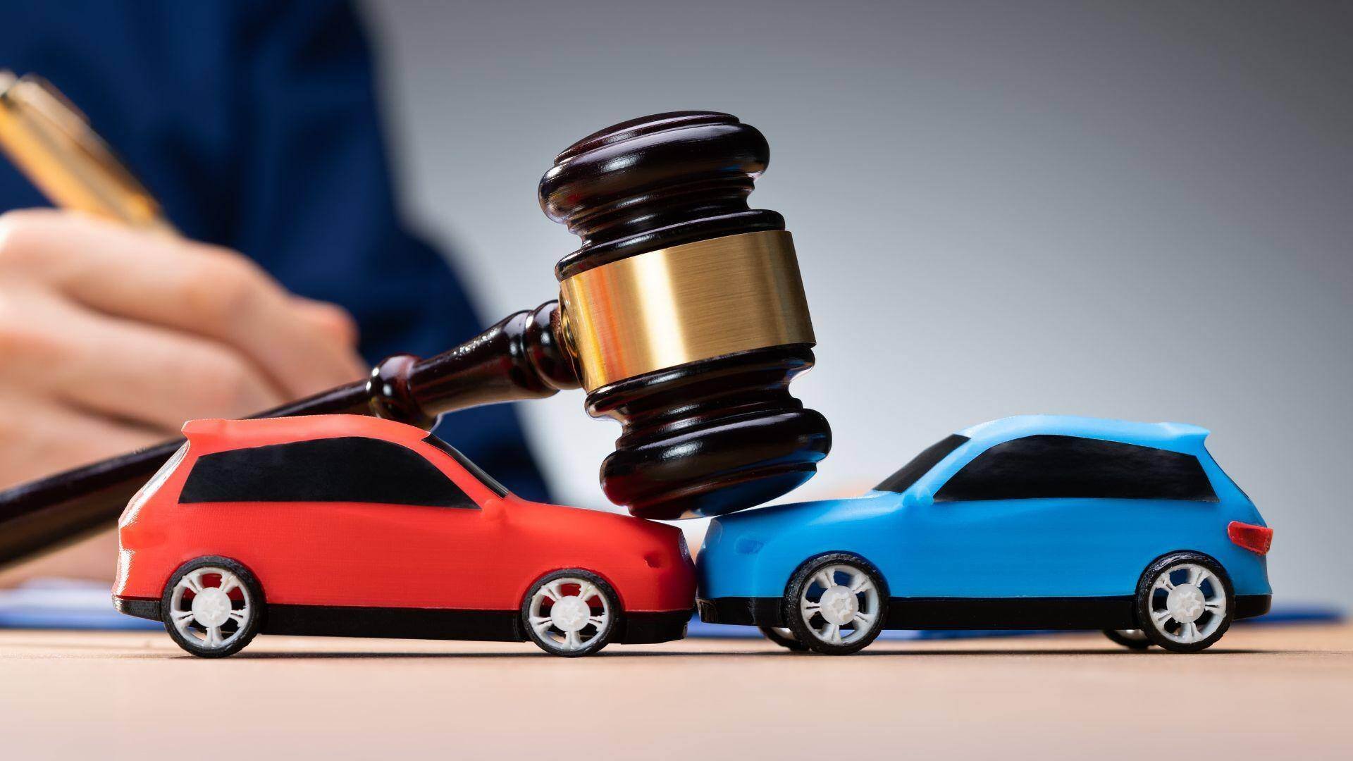 Two cars and a gavel in Foley, Alabama