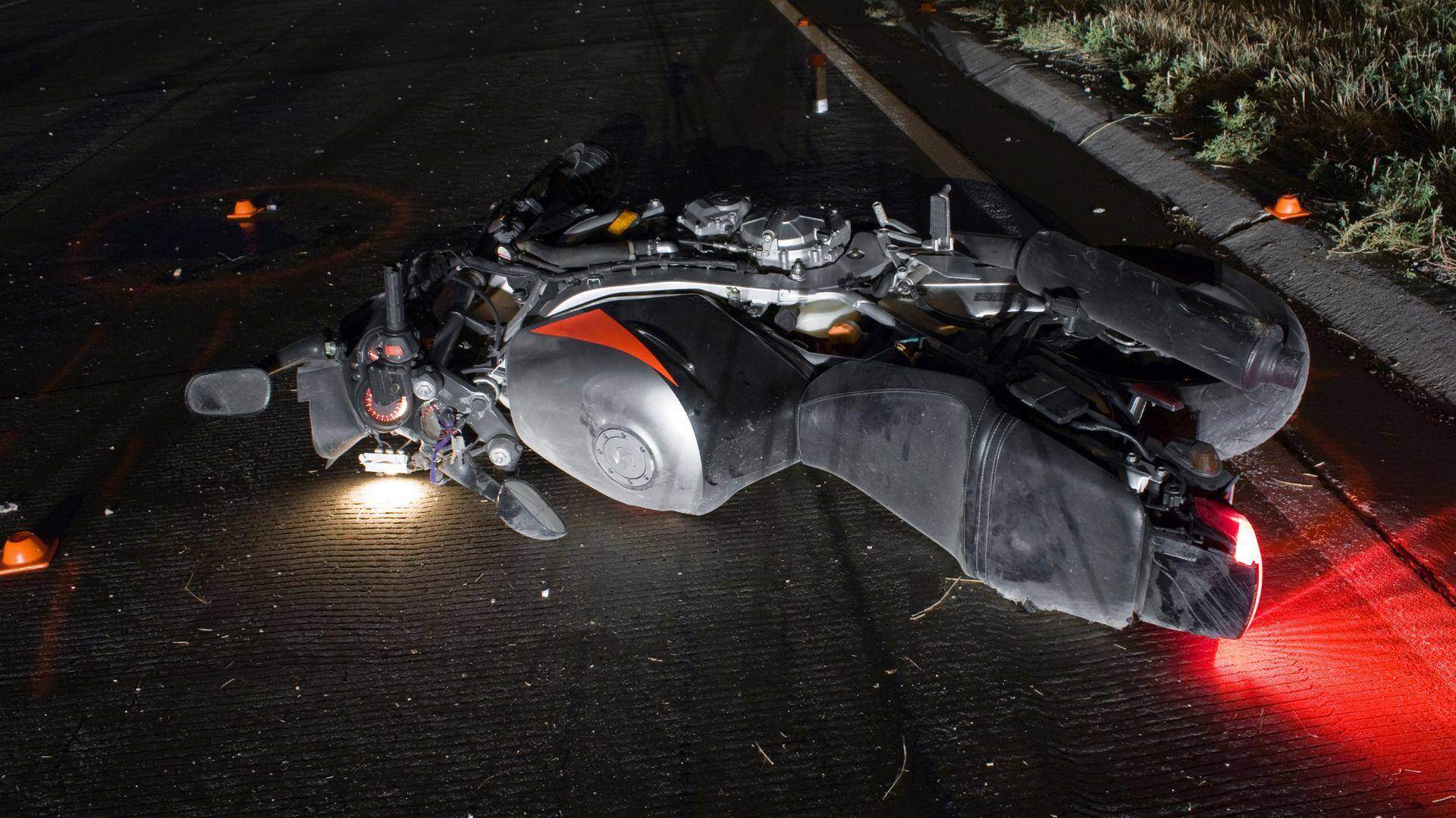 a motorcycle that has fallen over after a crash in Center Point, Alabama