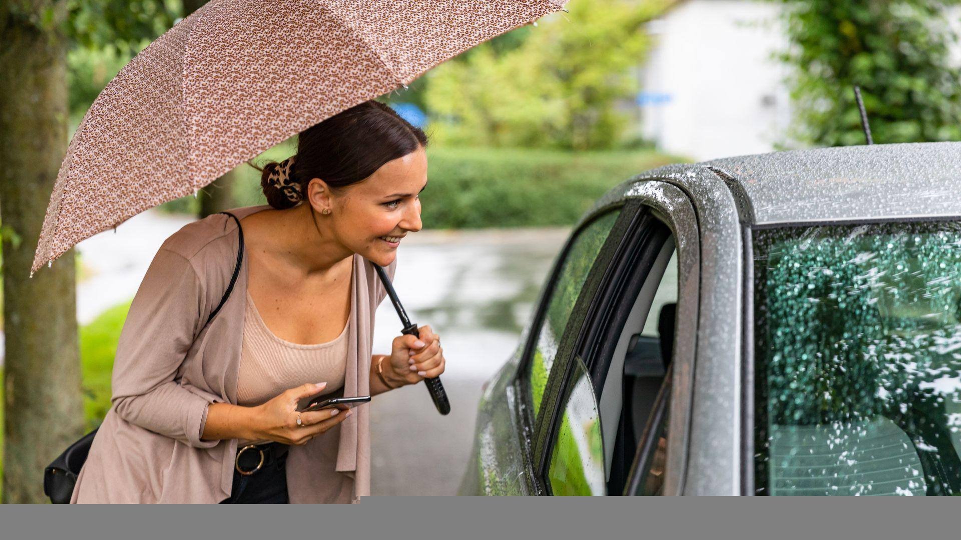 A lyft user meeting and getting into the car of the Lyft driver in Millbrook, Alabama